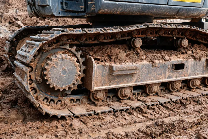 Compact excavator undercarriage close-up